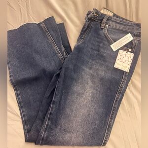 NWT Free people Jeans. Size 28. Dark wash and flare legged.
